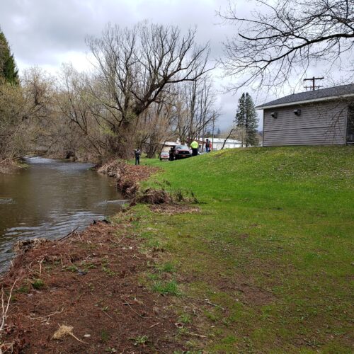 Walton Village's West Brook stream well bank stabilization project. Image shows stream and bank showing erosion pre-project.