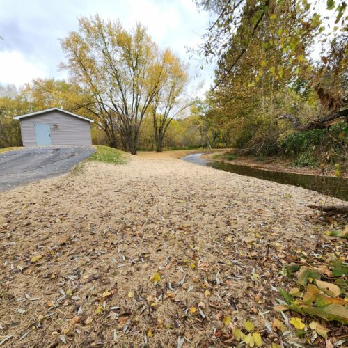 Walton Village's West Brook stream well bank stabilization project completion showing restored stream and banks.