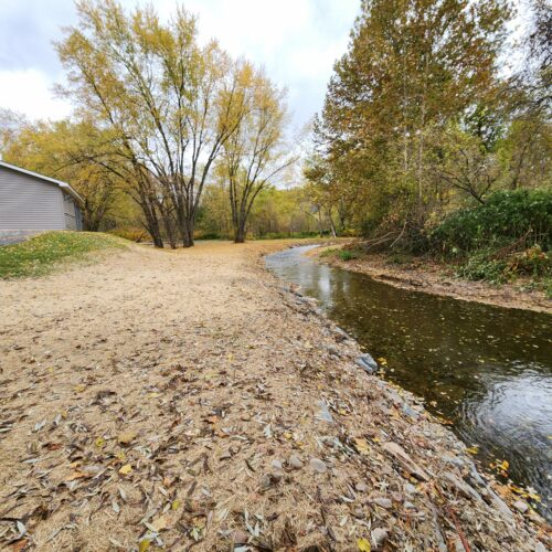 Walton Village's West Brook stream well bank stabilization project completion showing restored stream and banks.