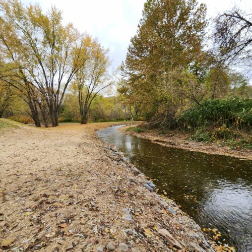 Walton Village's West Brook stream well bank stabilization project completion showing restored stream and banks.