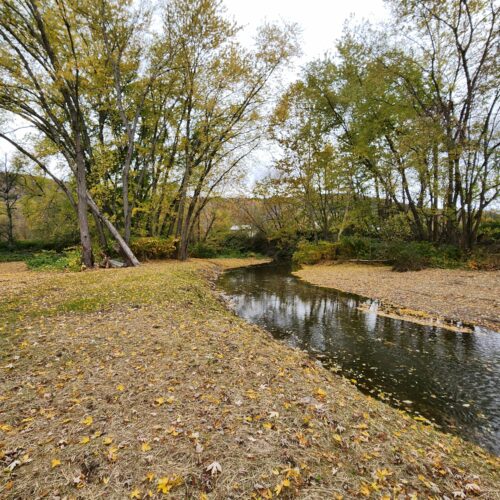 Walton Village's West Brook stream well bank stabilization project completion showing restored stream and banks.