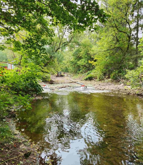 Walton Village's West Brook stream well bank stabilization project during construction. Image shows water being diverted from stream work area during project.